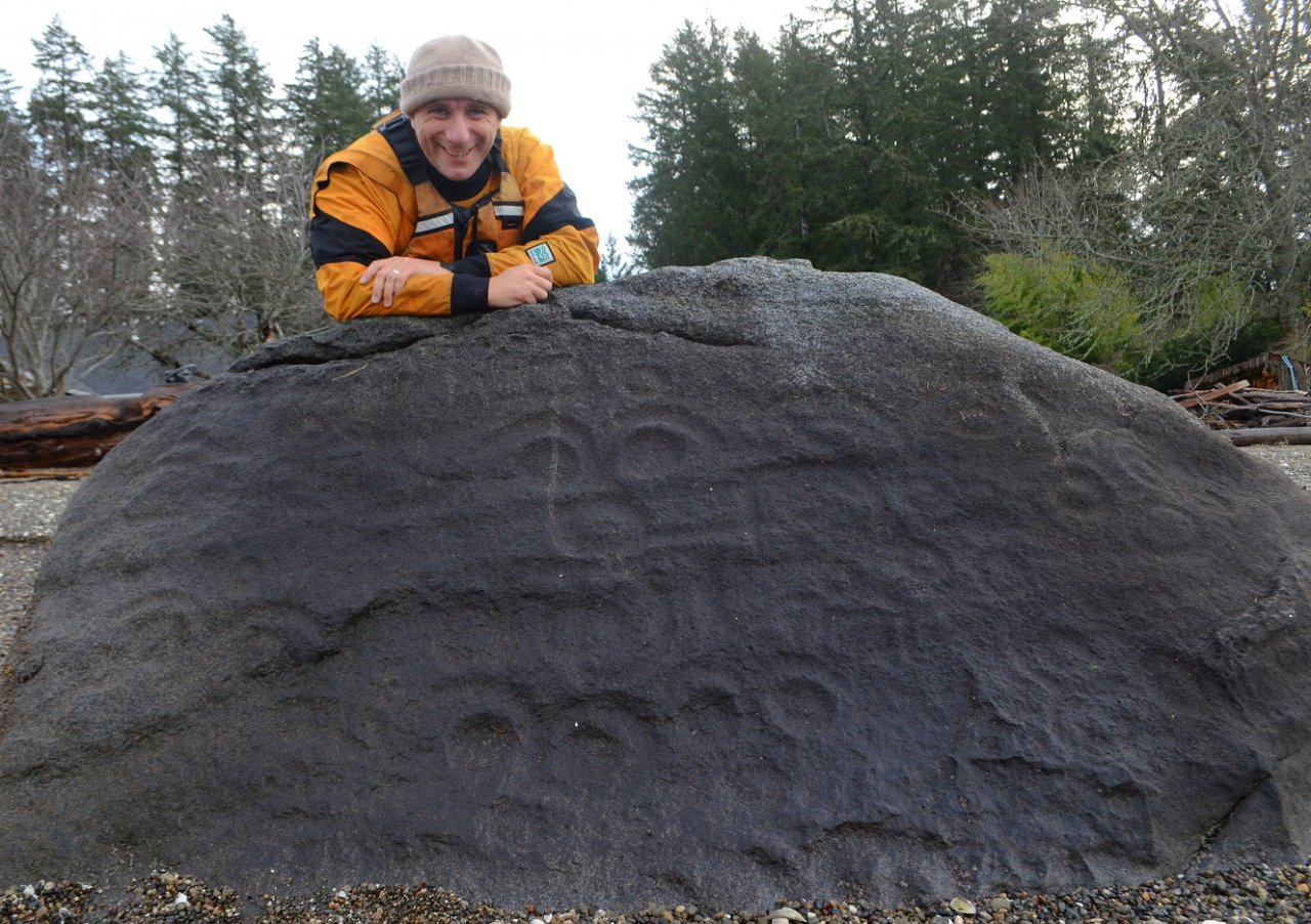 03 Alex with Case Inlet petroglyph at Victor.JPG