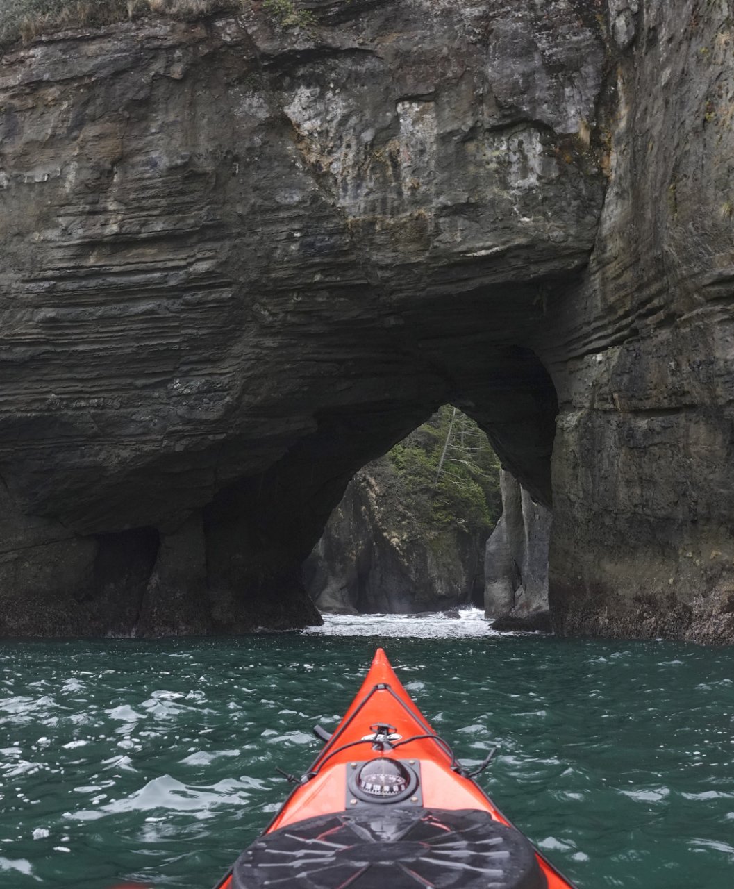 18 Kayaking under sea arch Cape Flattery.JPG